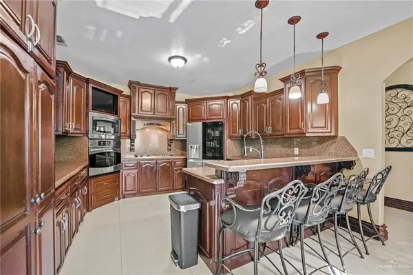 a dining room with furniture and chandelier