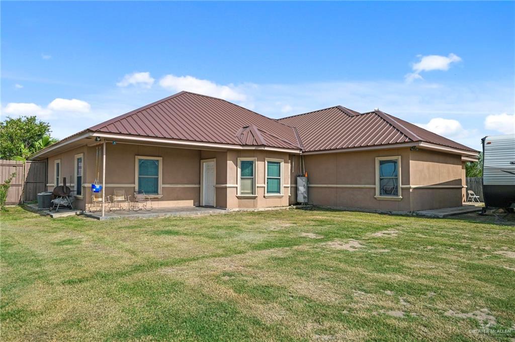 678 La Mesa Street Rio Grande City, TX 78582 - Photo 25 of 35 a front view of a house with a garden and porch