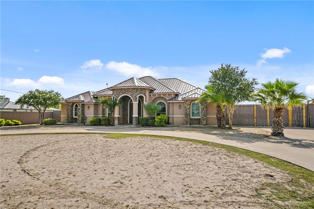 678 La Mesa Street Rio Grande City, TX 78582 - Photo 3 of 35 a front view of a house with a yard