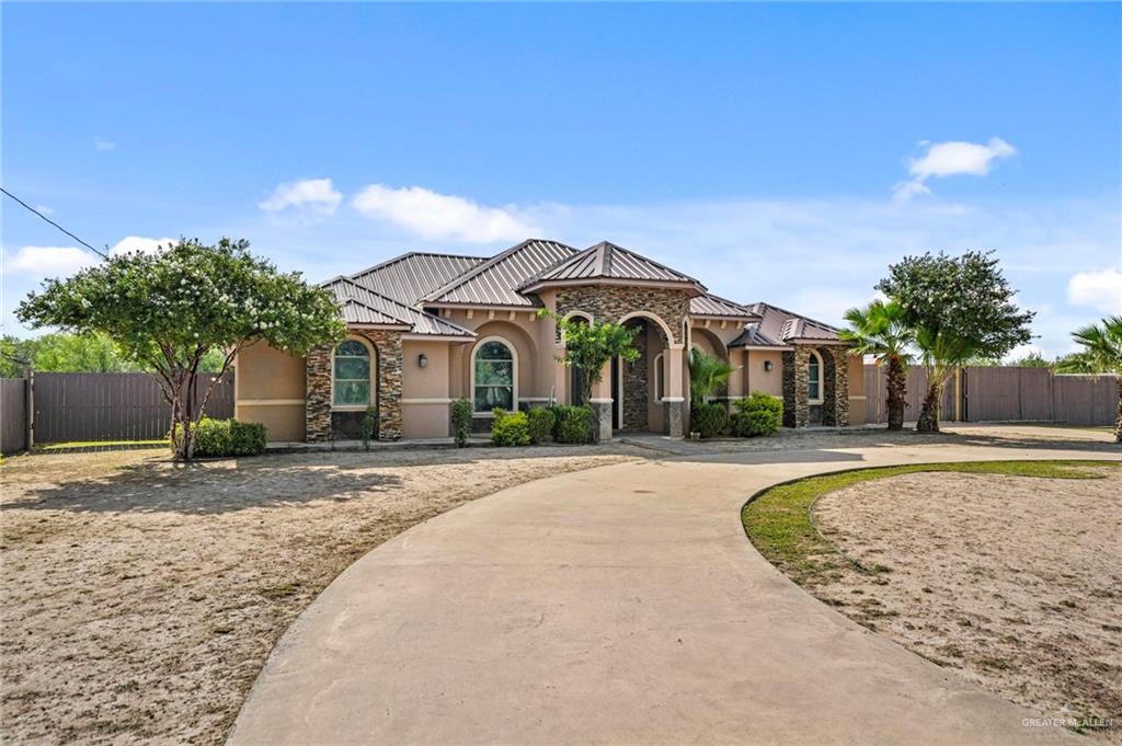 678 La Mesa Street Rio Grande City, TX 78582 - Photo 4 of 35 a front view of a house with a yard
