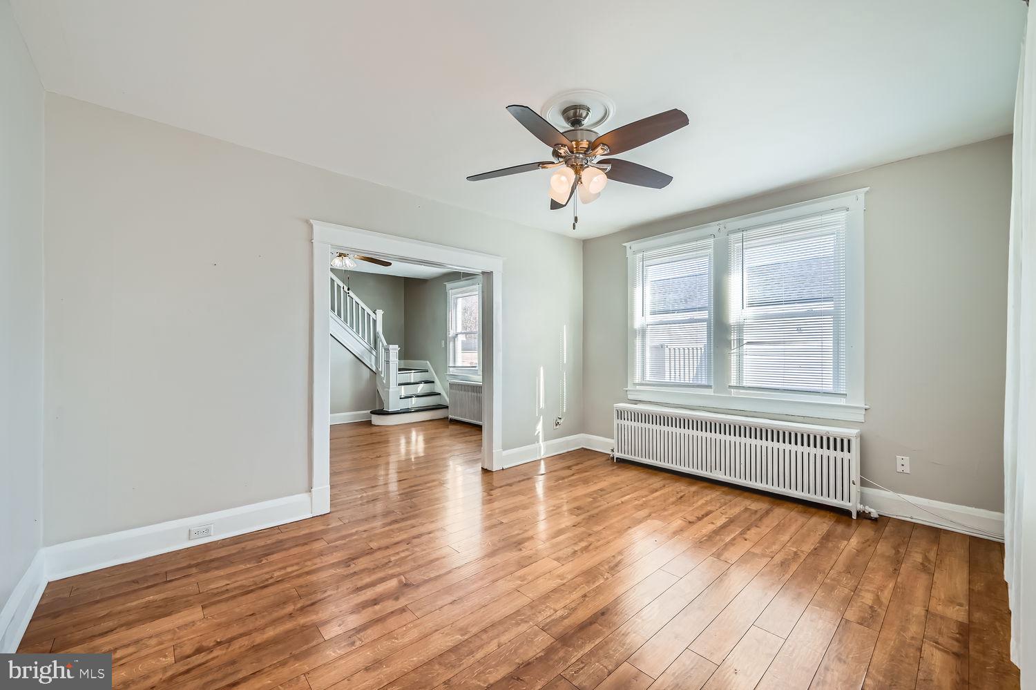 2328 Sparrows Point Road Sparrows Point, MD 21219 - Photo 6 of 28 a view of empty room with wooden floor and fan