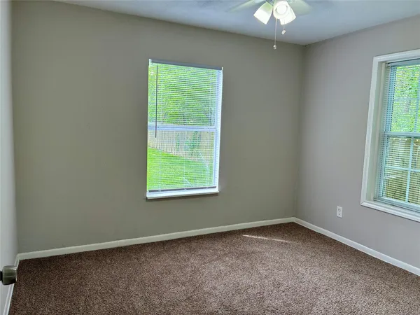 a view of storage and utility room with empty racks