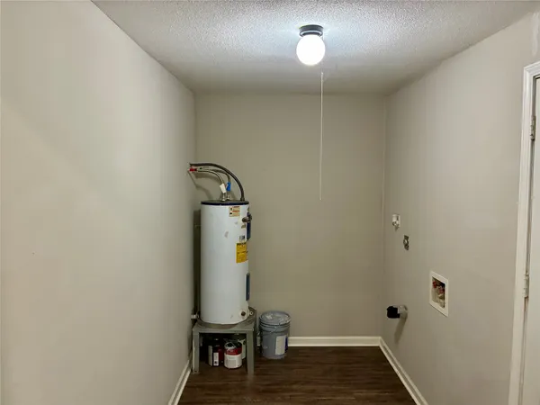 a front view of a house with yard and tree