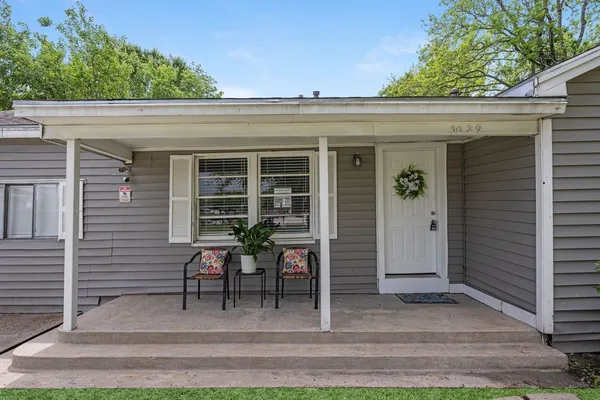 a view of front door and potted plants