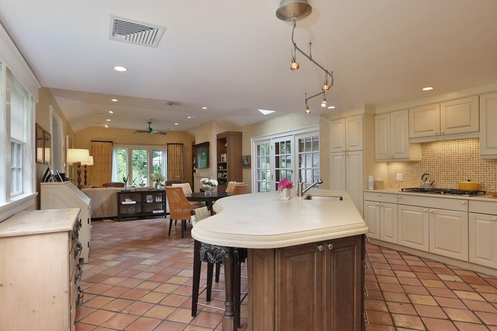 150 Monadnock Road Newton, MA 02467 - Photo 8 of 15 a large kitchen with a table and chairs