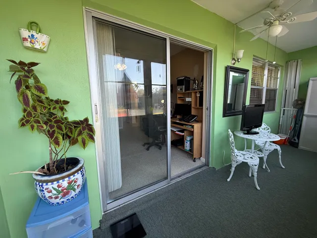 a view of swimming pool with outdoor seating