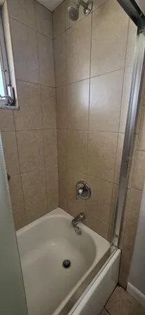 a bathroom with a sink and shower
