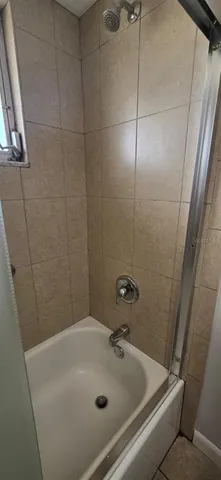a bathroom with a sink and shower