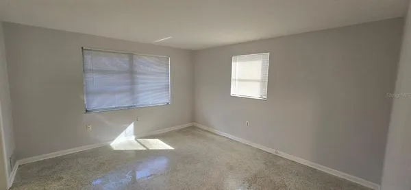 an empty room with windows
