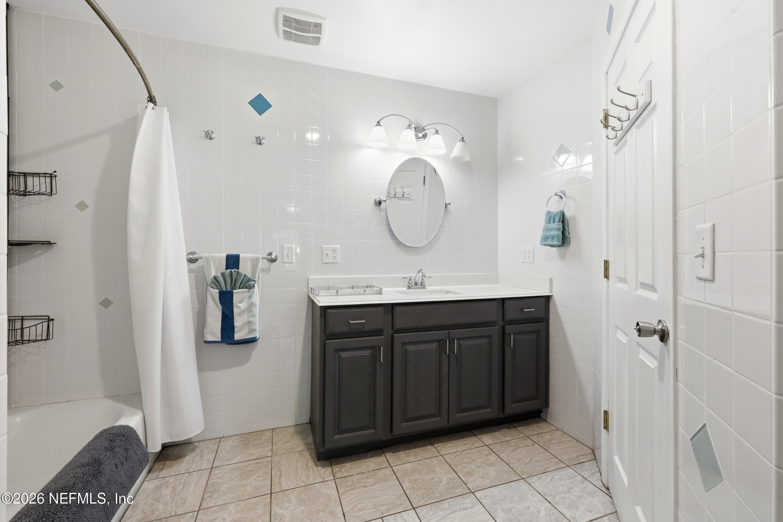 11627 Mandarin Terrace Road Jacksonville, FL 32223 - Photo 35 of 79 a bathroom with a sink vanity and a mirror