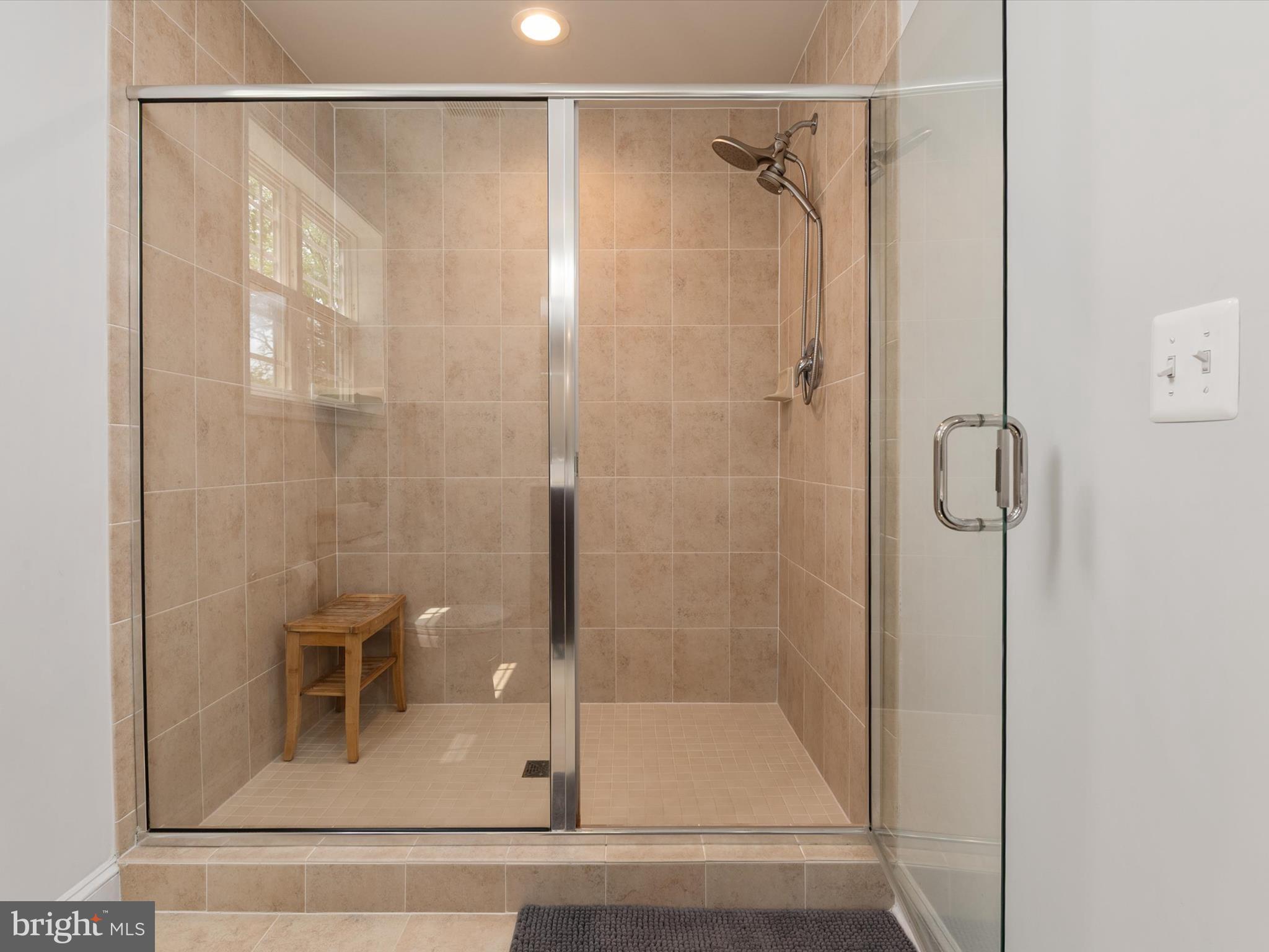 933 Winding Road Edgewater, MD 21037 - Photo 23 of 47 Tiled shower and glass door