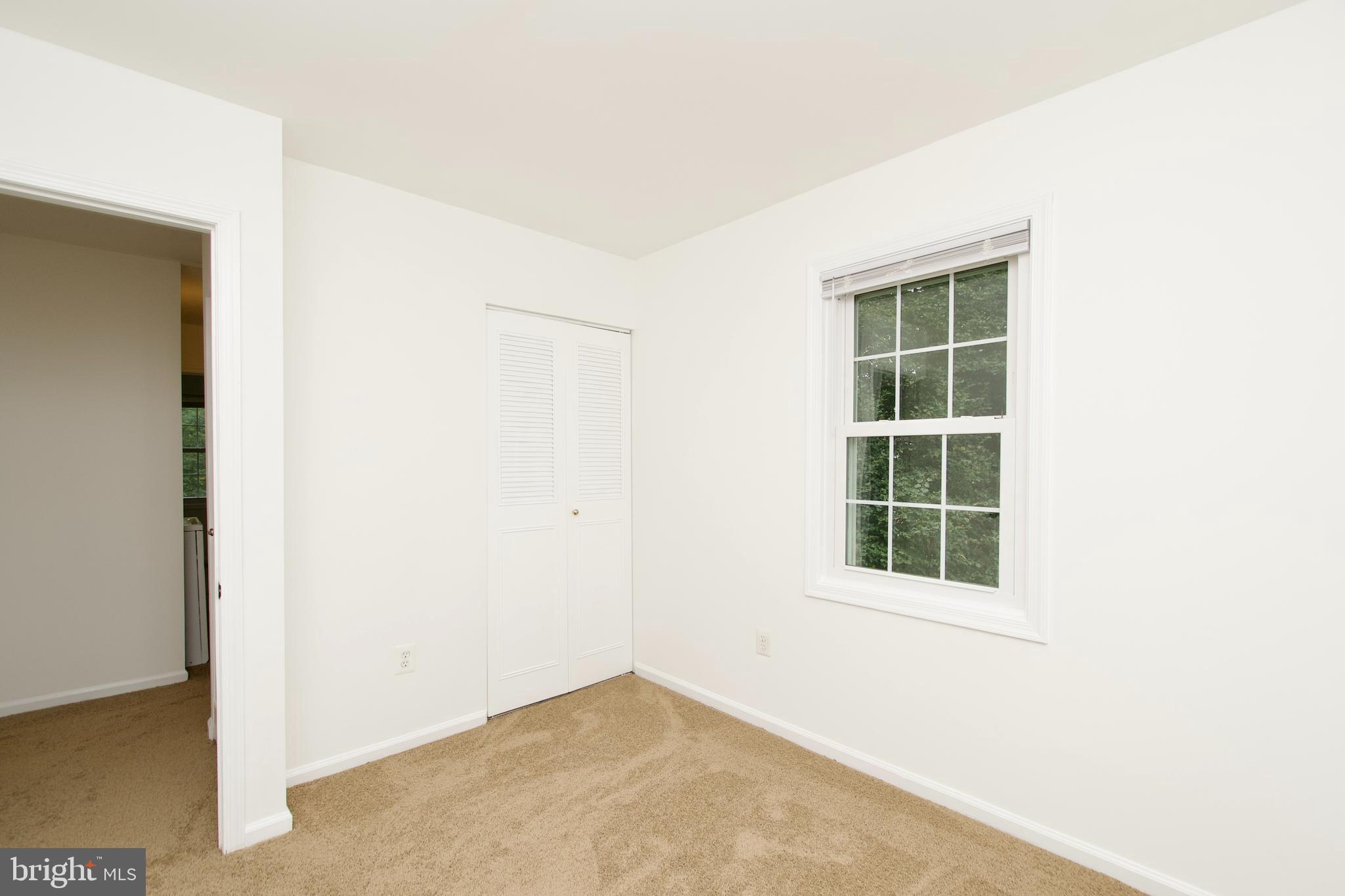 1448 Orleans Court Crofton, MD 21114 - Photo 20 of 33 an empty room with windows and closet