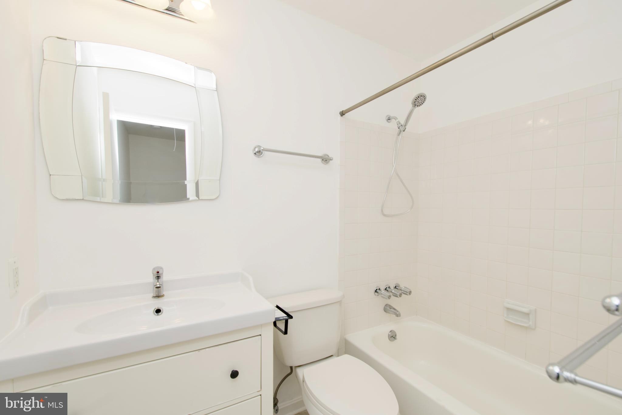 1448 Orleans Court Crofton, MD 21114 - Photo 21 of 33 a bathroom with a sink a toilet and shower