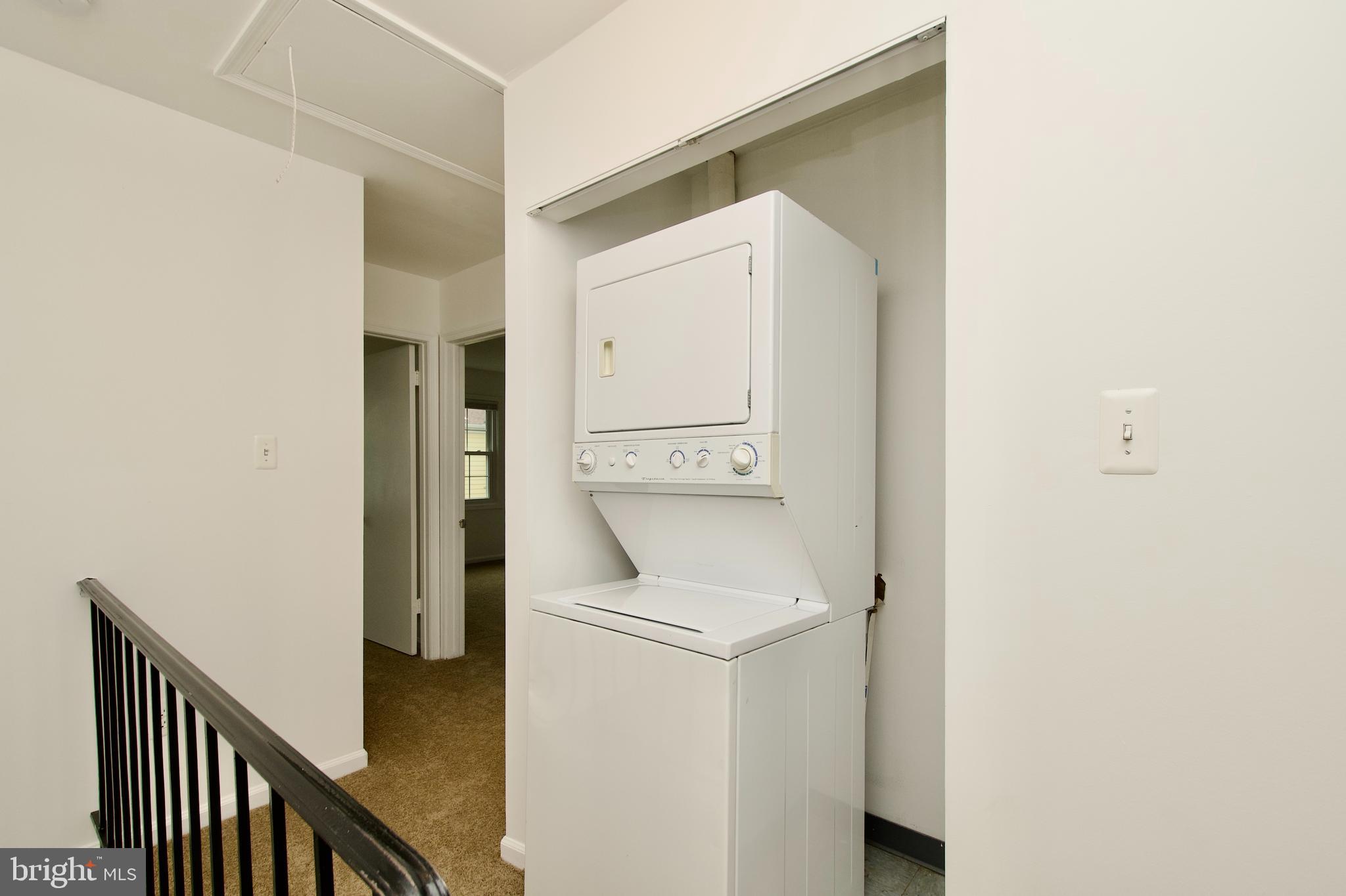 1448 Orleans Court Crofton, MD 21114 - Photo 23 of 33 a utility room with dryer and washer