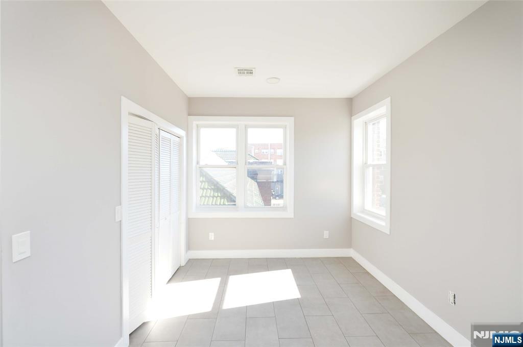7 Watsessing Avenue, Unit 2R Bloomfield, NJ 07003 - Photo 2 of 14 a view of an empty room with a window
