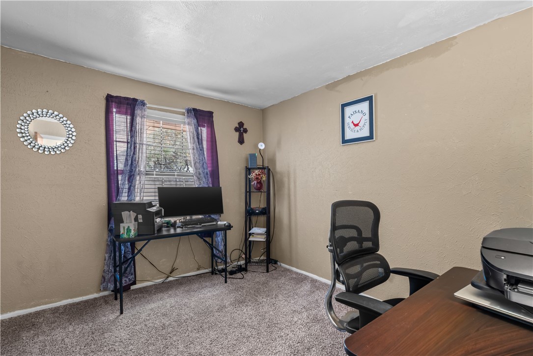 324 Stirrup Road Victoria, TX 77905 - Photo 20 of 40 a view of a workspace with furniture and a window