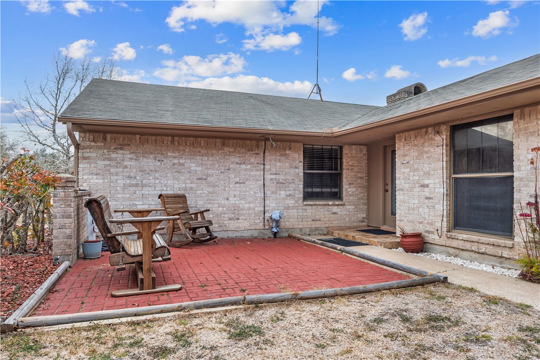 324 Stirrup Road Victoria, TX 77905 - Photo 30 of 40 a table and chairs in front of the house