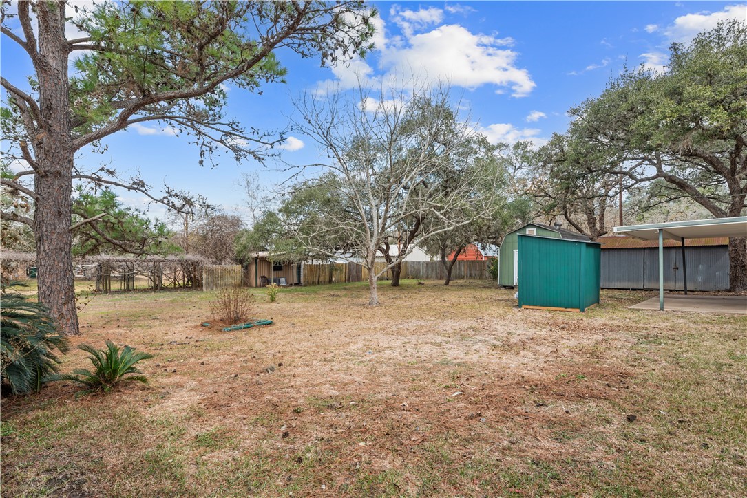 324 Stirrup Road Victoria, TX 77905 - Photo 34 of 40 a backyard of a house with a yard and garage