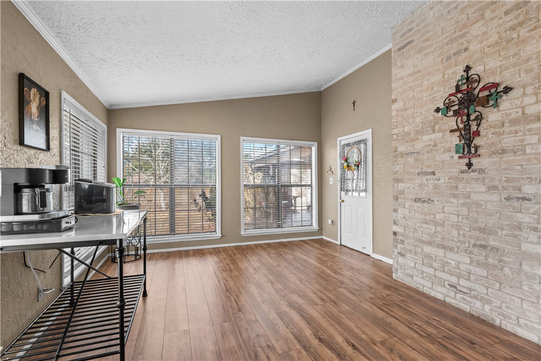 324 Stirrup Road Victoria, TX 77905 - Photo 9 of 40 a view of a livingroom with furniture and wooden floor
