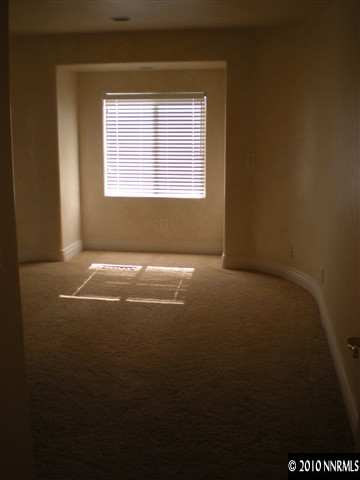 75 Gazelle Road Reno, NV 89511 - Photo 6 of 8 a view of an empty room with a window