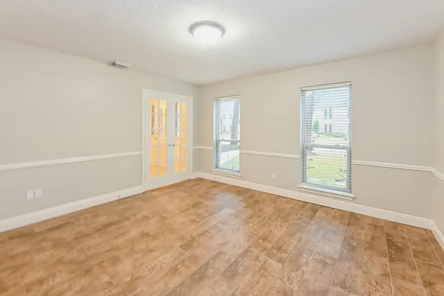 an empty room with windows