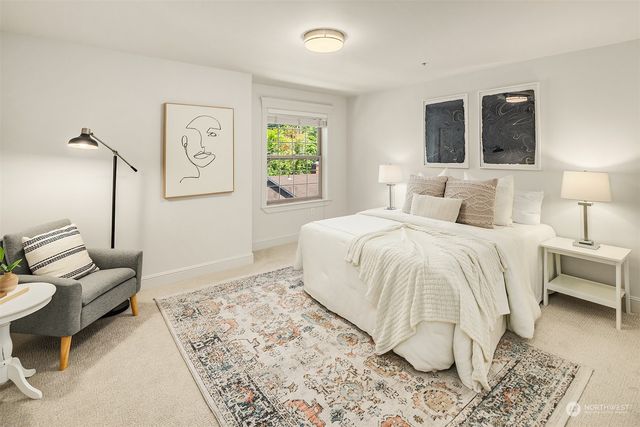 a bedroom with a bed and couch