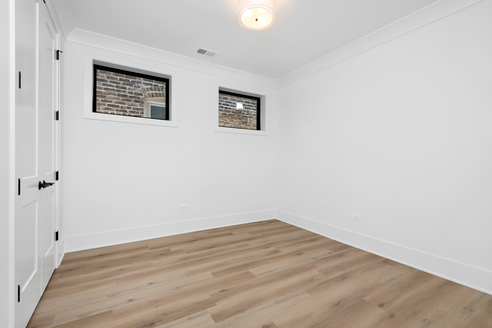 2051 North Racine Avenue, Unit 1 Chicago, IL 60614 - Photo 13 of 21 a view of a hallway with wooden floor