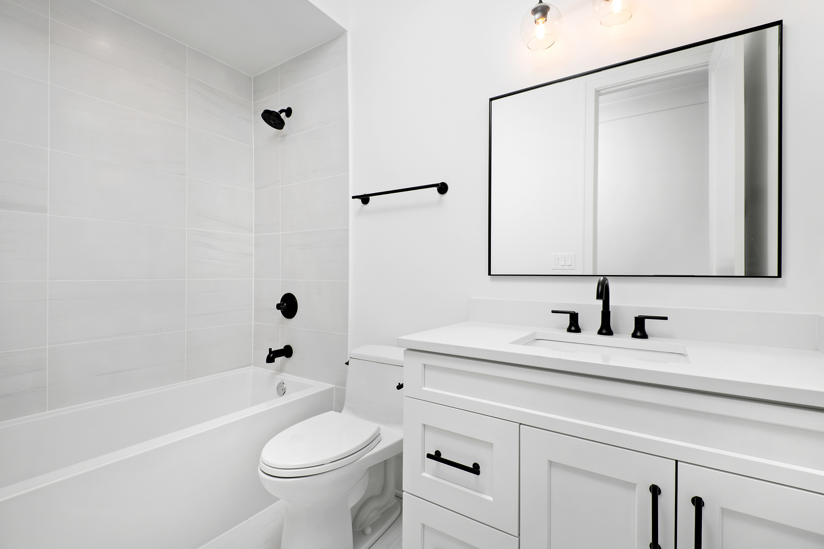 2051 North Racine Avenue, Unit 1 Chicago, IL 60614 - Photo 14 of 21 a bathroom with a sink a toilet and a mirror