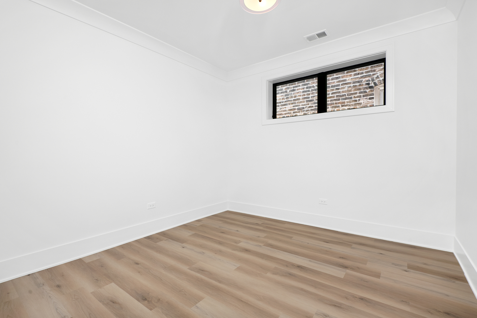 2051 North Racine Avenue, Unit 1 Chicago, IL 60614 - Photo 16 of 21 a view of a hallway with wooden floor