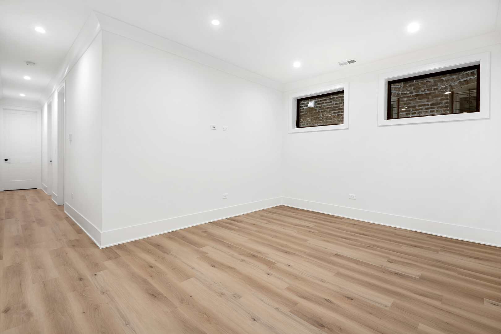 2051 North Racine Avenue, Unit 1 Chicago, IL 60614 - Photo 18 of 21 a view of empty room with wooden floor
