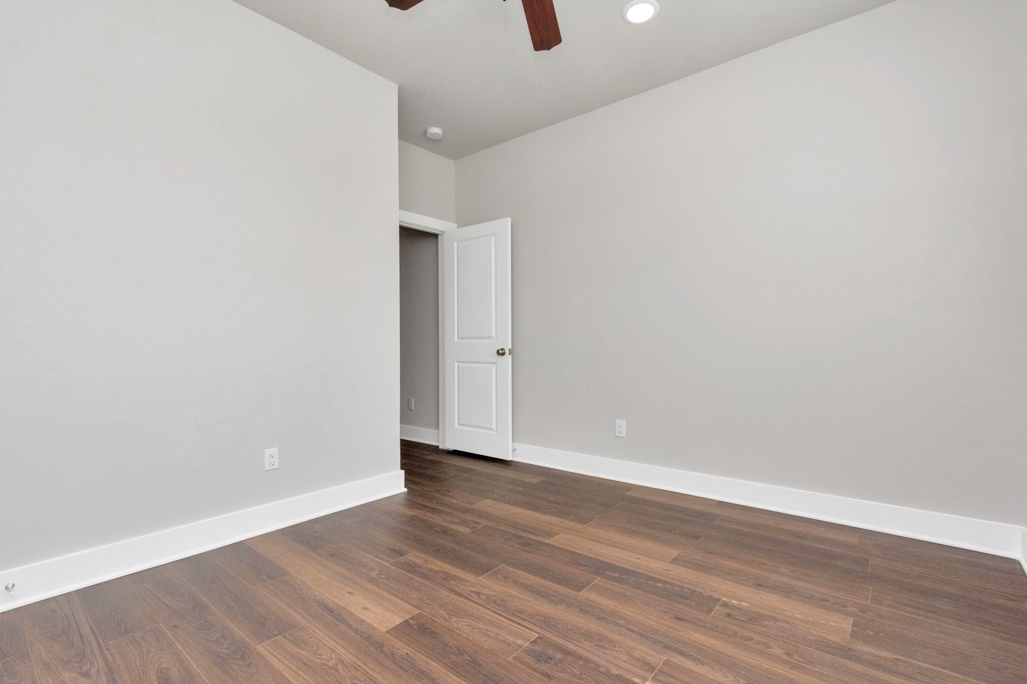 10523 Moon Valley Lane Rosharon, TX 77583 - Photo 14 of 24 a view of an empty room with wooden floor