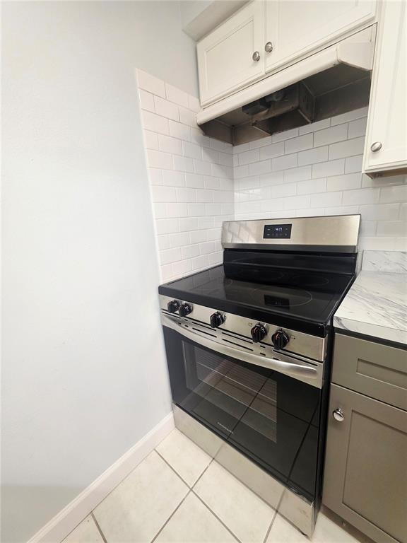 4461 Rustic Drive, Unit 4461 New Port Richey, FL 34652 - Photo 11 of 34 a stove top oven sitting inside of a kitchen