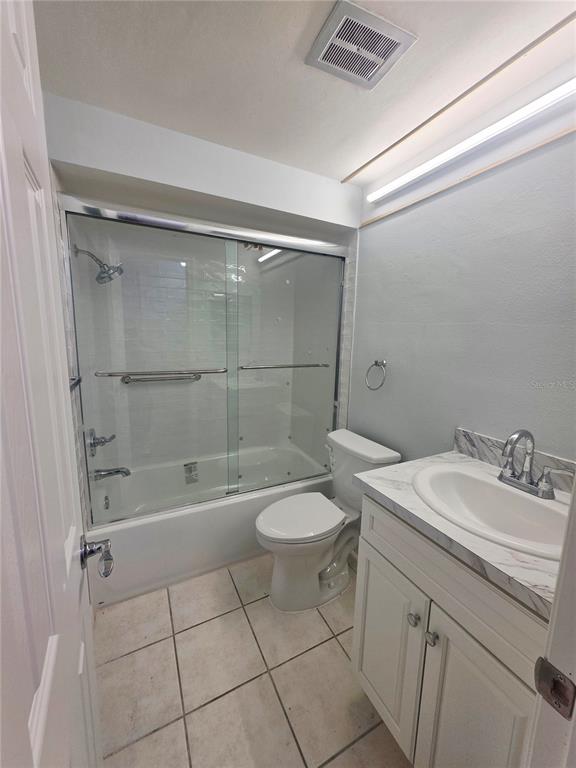4461 Rustic Drive, Unit 4461 New Port Richey, FL 34652 - Photo 13 of 34 a bathroom with a sink a toilet and shower