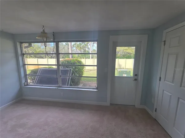 a view of empty room with windows