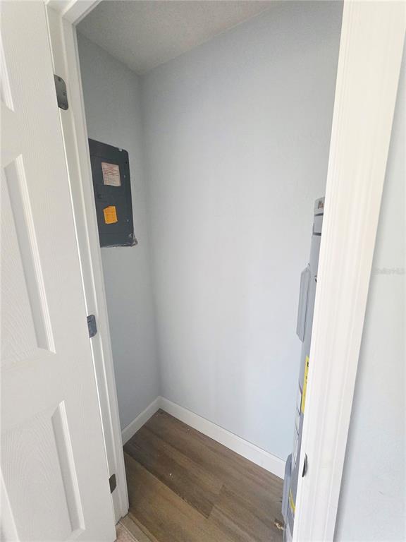 4461 Rustic Drive, Unit 4461 New Port Richey, FL 34652 - Photo 18 of 34 a view of a hallway with wooden floor and stairs