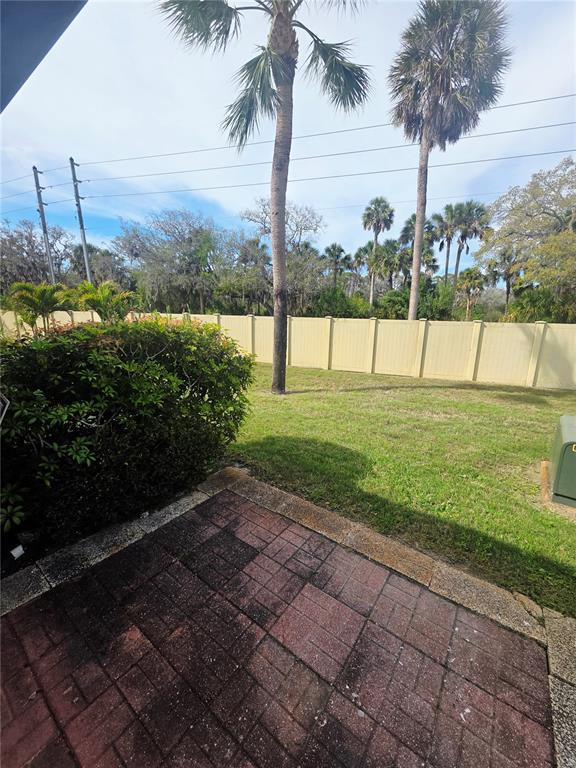 4461 Rustic Drive, Unit 4461 New Port Richey, FL 34652 - Photo 22 of 34 a view of a yard and entertaining space