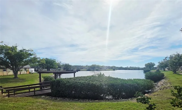a view of a golf course with a lake