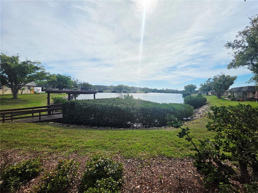 4461 Rustic Drive, Unit 4461 New Port Richey, FL 34652 - Photo 24 of 34 a view of a golf course with a lake