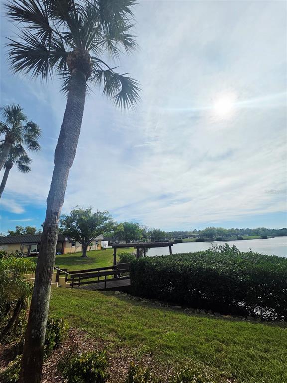 4461 Rustic Drive, Unit 4461 New Port Richey, FL 34652 - Photo 25 of 34 an aerial view of a golf course with chairs