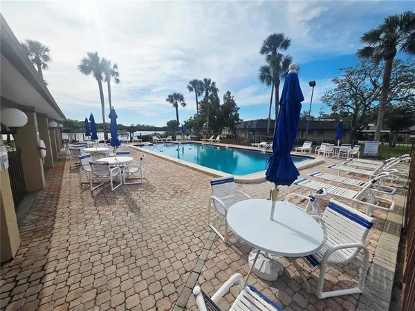 a view of a swimming pool with a lounge chair