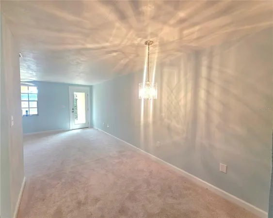 a kitchen with a sink cabinets and window