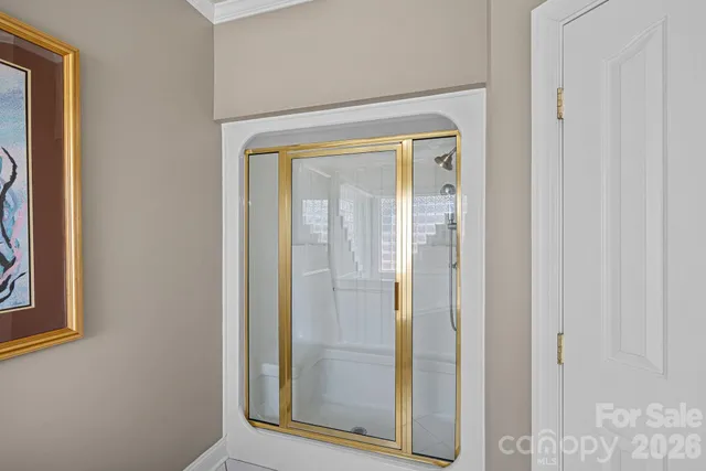 a view of a bathroom from a hallway