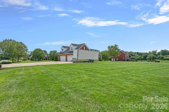 a aerial view of a house with a yard
