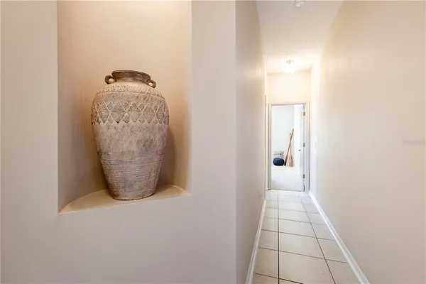 a bathroom with a granite countertop mirror and a sink