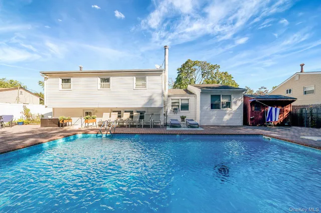 a backyard of a house with seating space