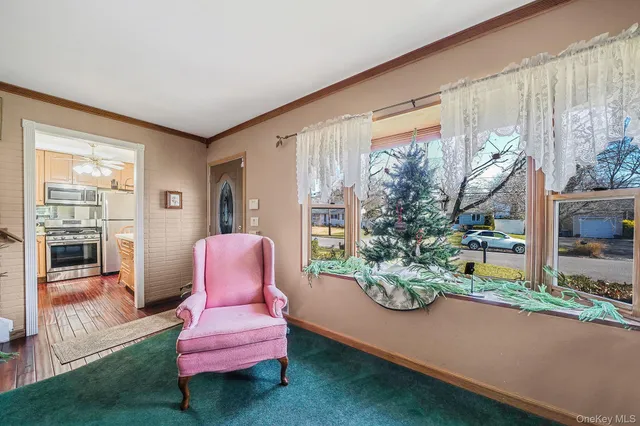 a kitchen with stainless steel appliances granite countertop a refrigerator a stove a sink dishwasher and a microwave with wooden floor