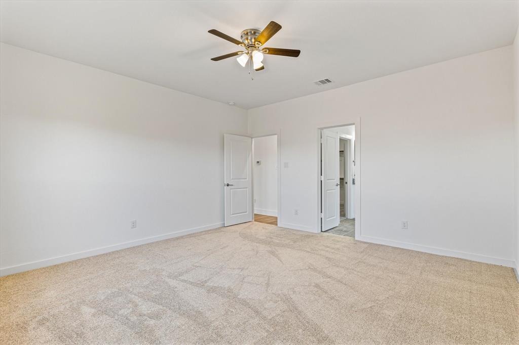 428 Cirrus Circle Muenster, TX 76252 - Photo 11 of 30 an empty room with closet and a ceiling fan