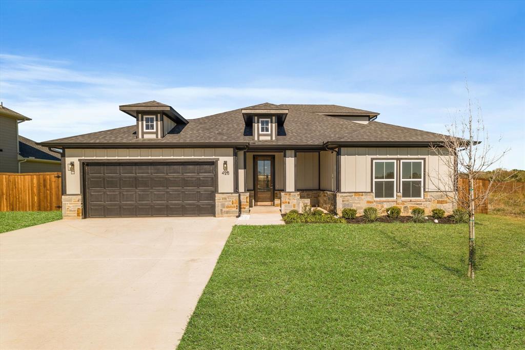 428 Cirrus Circle Muenster, TX 76252 - Photo 2 of 30 a front view of a house with a garden and porch