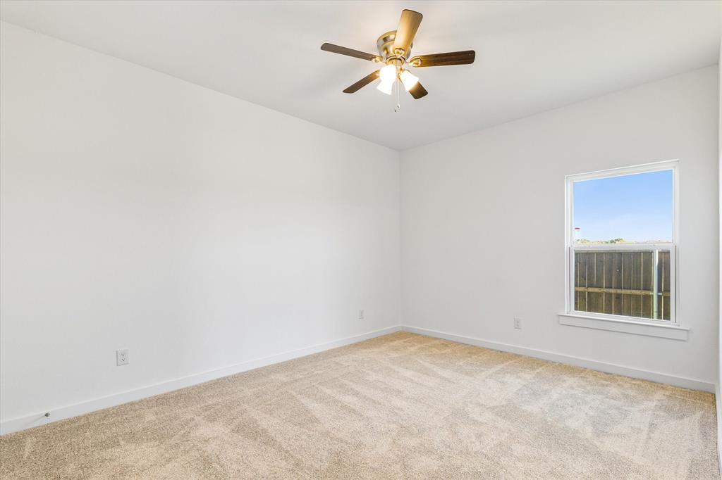 428 Cirrus Circle Muenster, TX 76252 - Photo 21 of 30 an empty room with a window and a fan