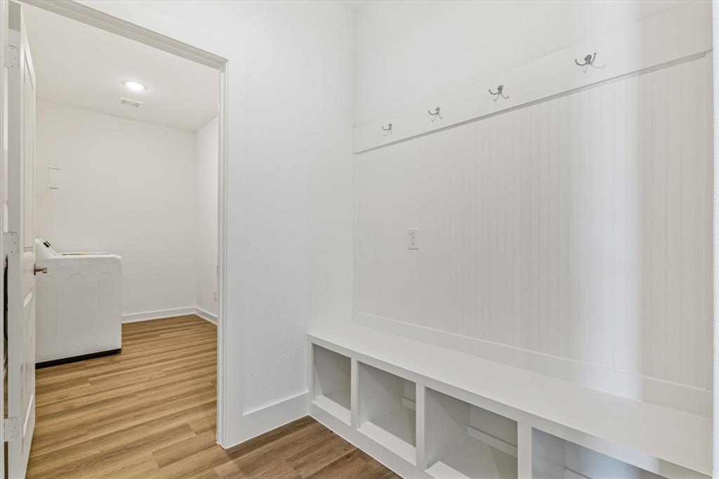 428 Cirrus Circle Muenster, TX 76252 - Photo 23 of 30 a view of walk in closet with wooden floor
